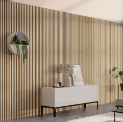 A modern living space featuring a light wood slat wall, a white sideboard, and a circular wall planter with greenery.