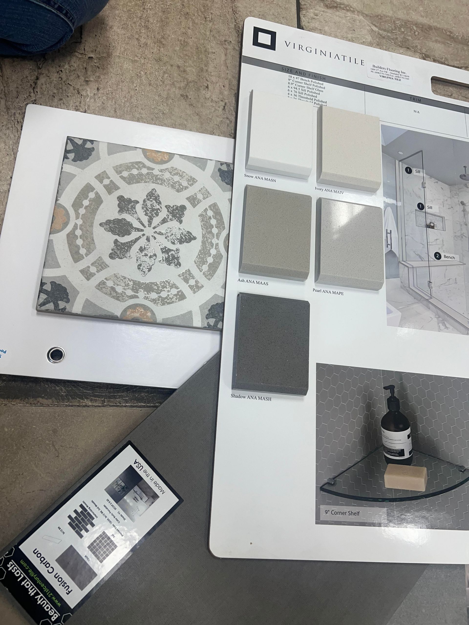 A selection of tiles and a soap dispenser on a table