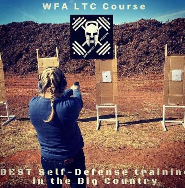 Woman Shooting Target at the Shooting Range