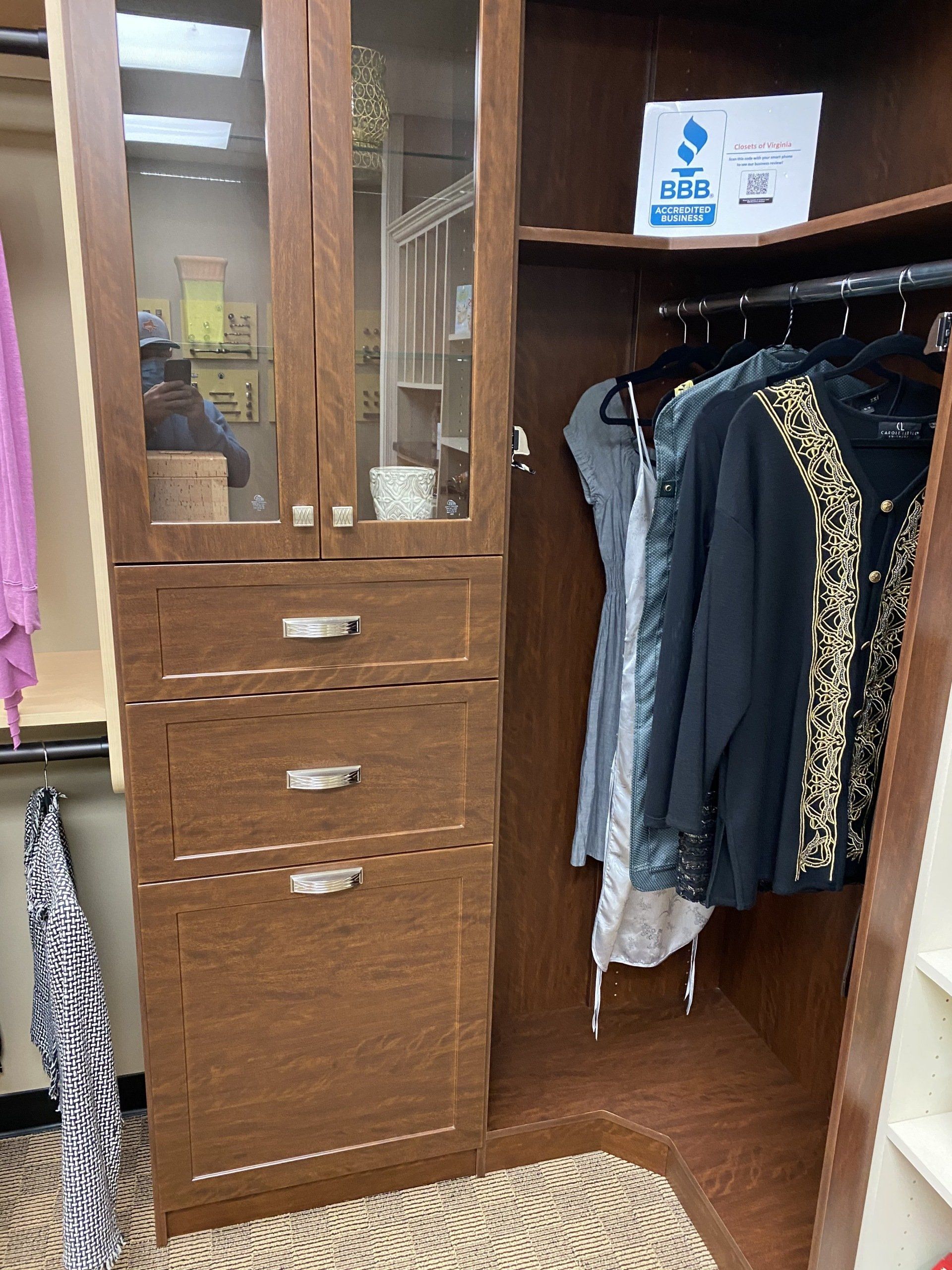 A closet filled with clothes and a sign that says sale