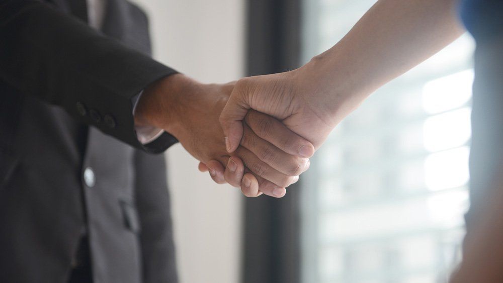 Attorney Shaking Client's Hand — Dos Palos, CA — Linneman Law Attorney Shaking Client's Hand — Dos Palos, CA — Linneman Law