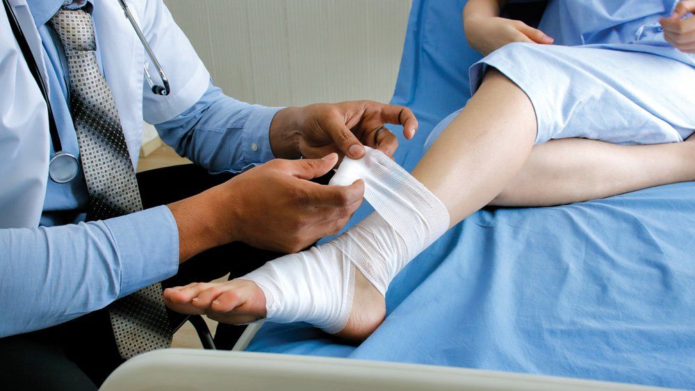 Putting Bandage On Leg — Dos Palos, CA — Linneman Law Putting Bandage On Leg — Dos Palos, CA — Linneman Law