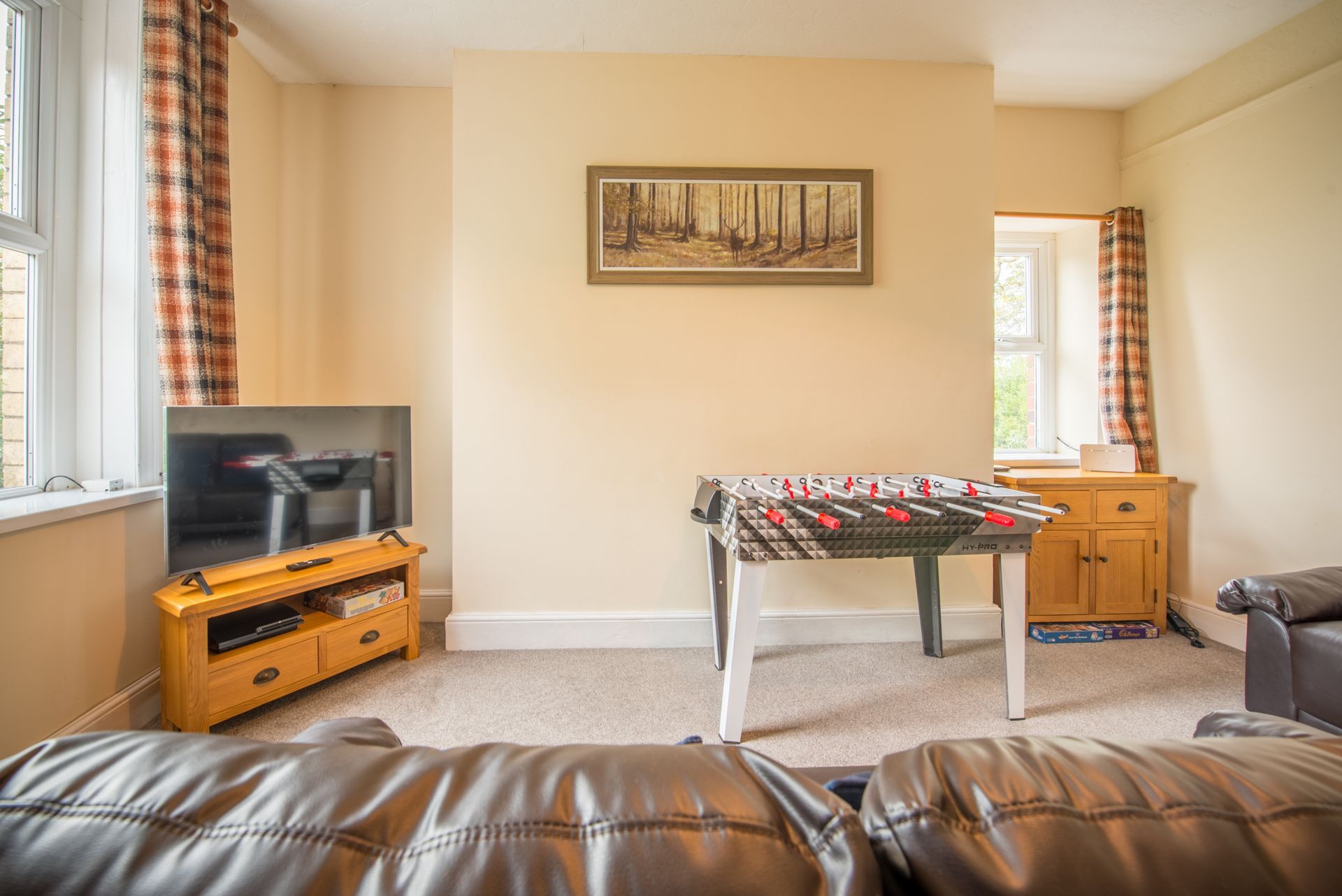 Dining table and fireplace in The Farmhouse at Green Grove Barns.