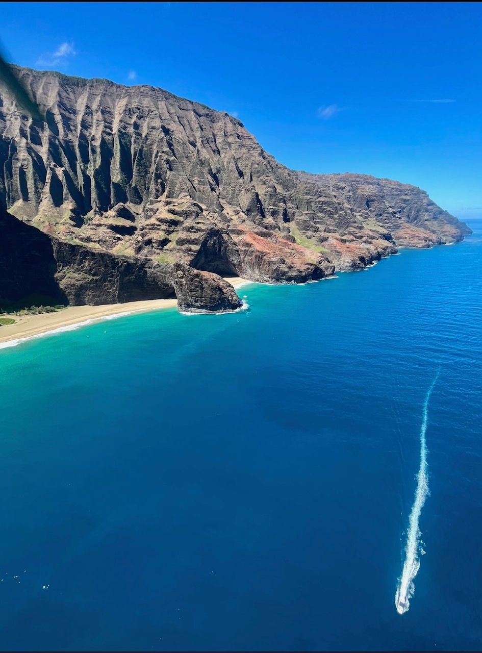 An aerial view of a body of water with mountains in the background.