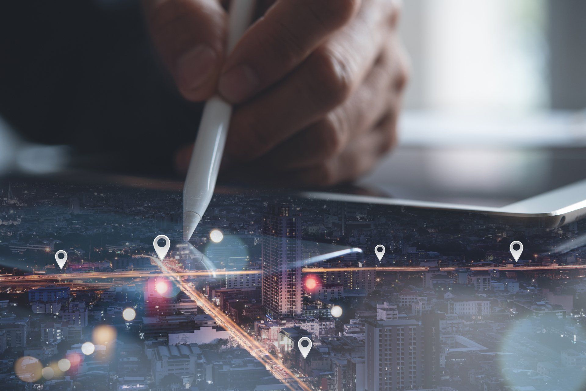 A person is writing on a tablet with a pen.