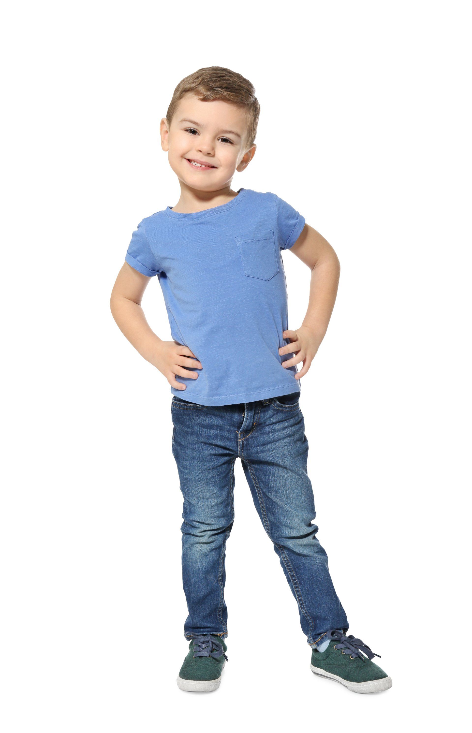cute little boy standing with hands on hips
