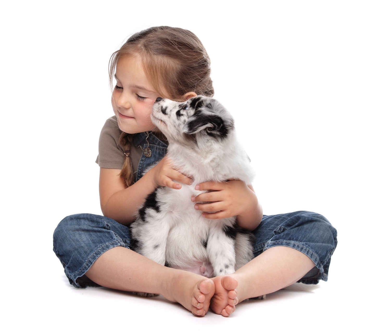 cute little girl holding puppy