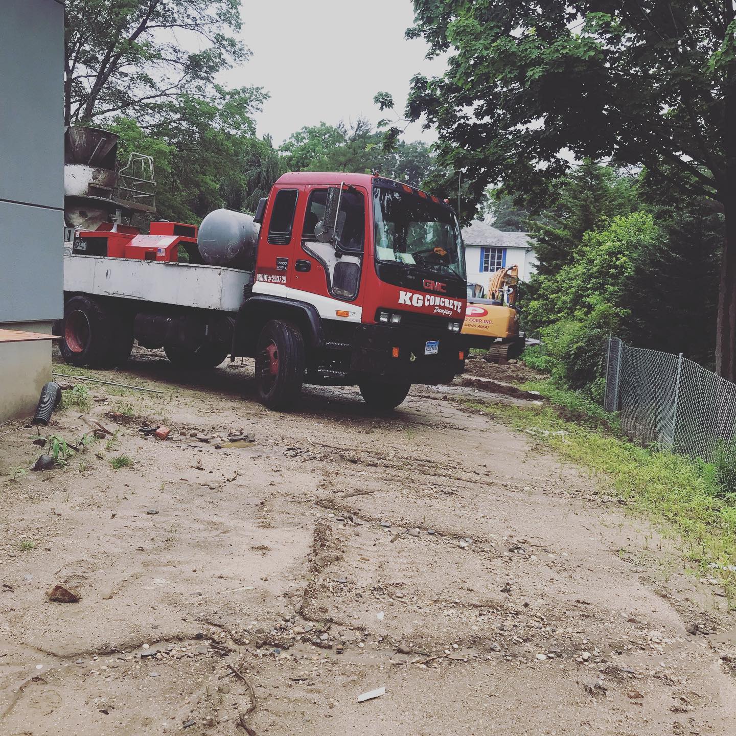 Construction Worker Troweling Wet Concrete — Inwood, NY — KG Concrete Pumping Corp