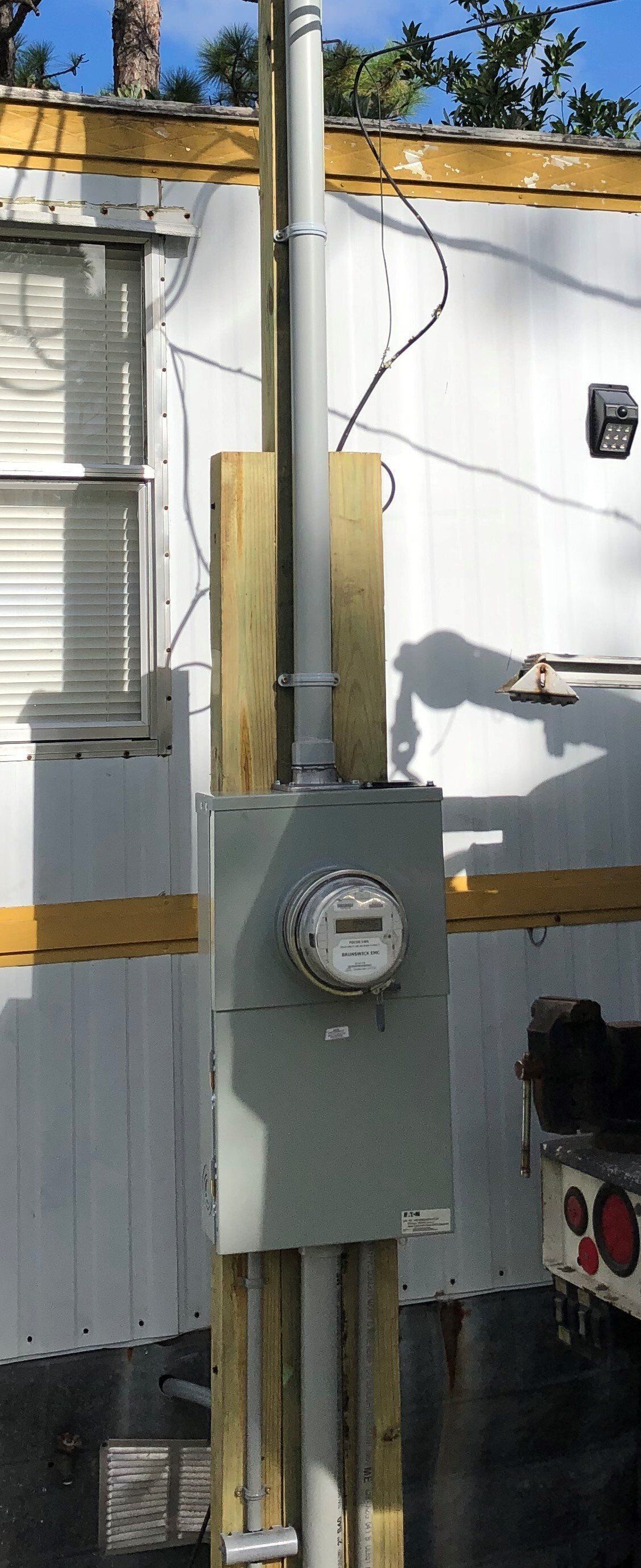 A meter is mounted on the side of a building