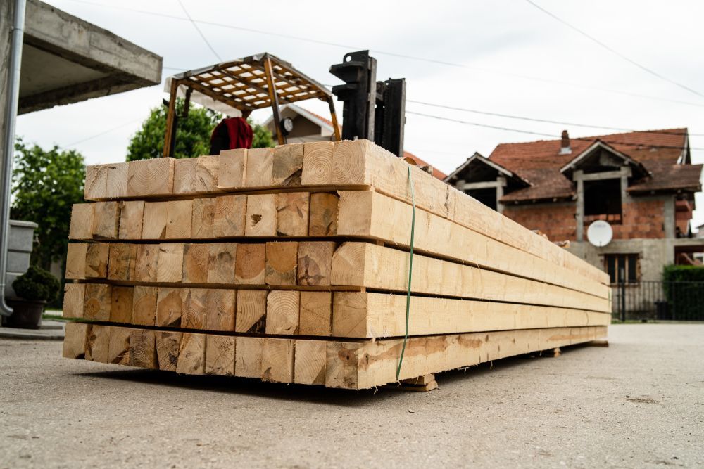 Forklift Carrying a Stack of Lumber — Sly Bros in Murwillumbah, NSW