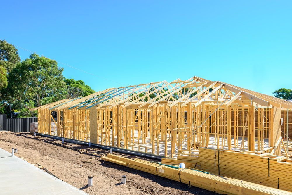 House Frame Under Construction With Exposed Wood — Sly Bros in Woodburn, NSW