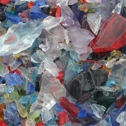 A pile of broken glass of different colors and sizes.