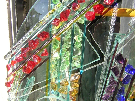 A bunch of colorful glass beads hanging on a wall