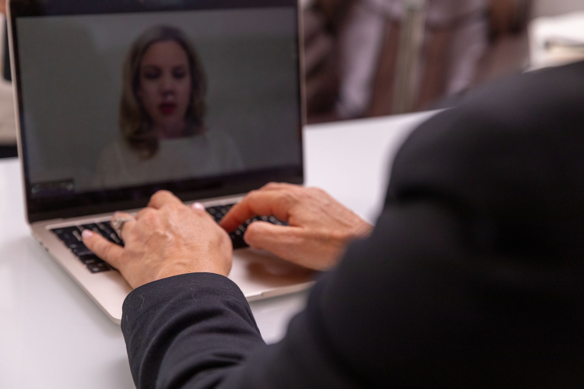 A man is using a laptop computer to have a video call with a woman.