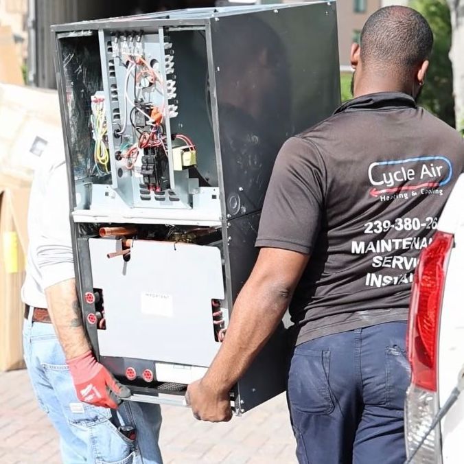 a man wearing a shirt that says earth is carrying a machine
