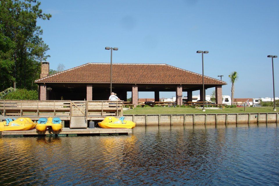 photo of pavilion and watercraft from lake