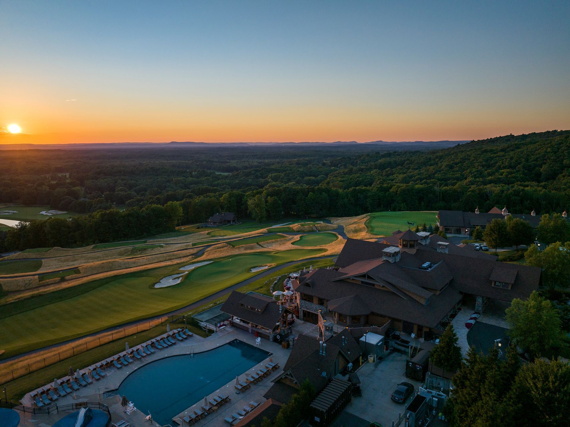 Aerial view of sunset from above & behind clubhouse
