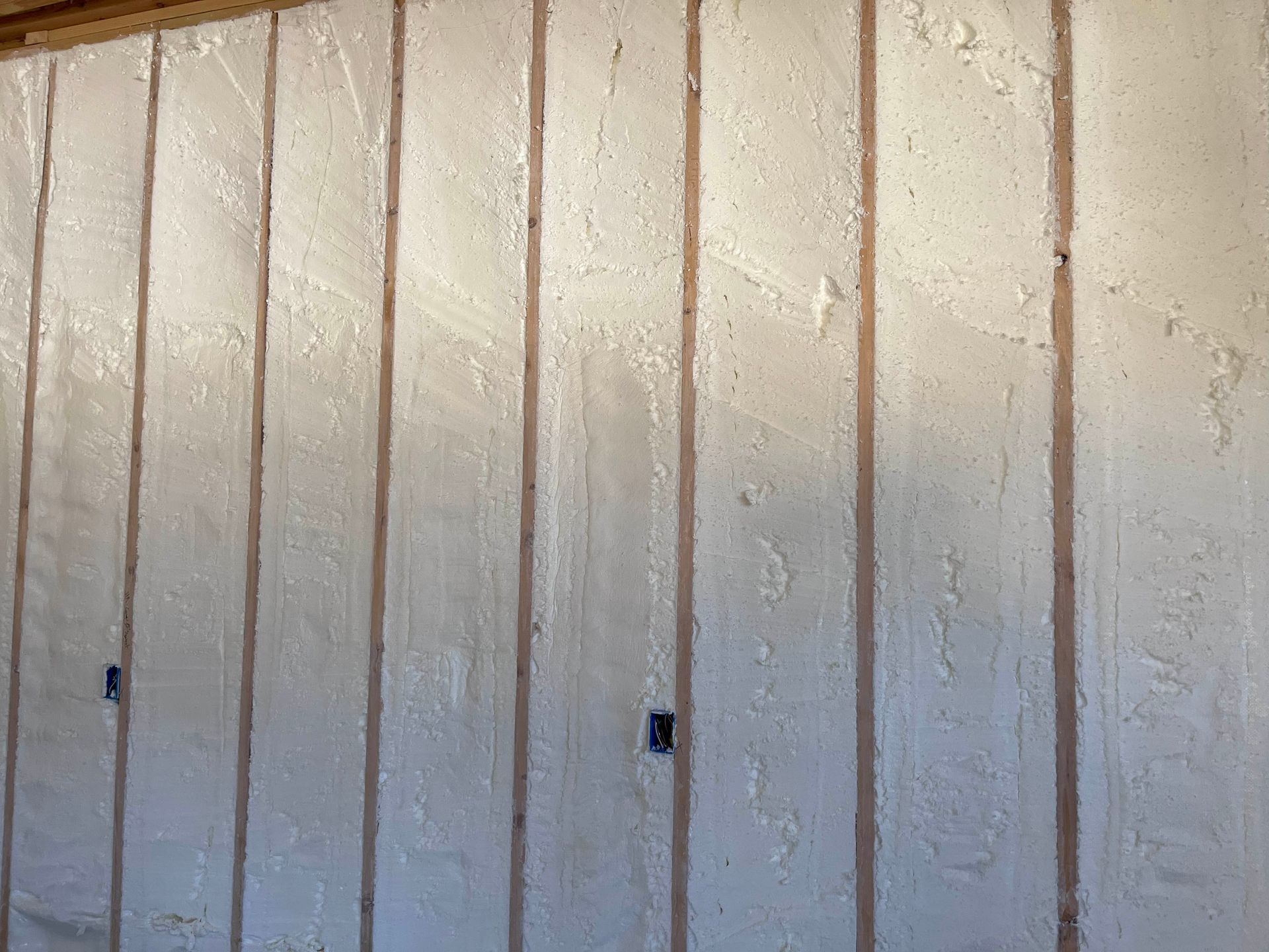 A white wall with a lot of insulation on it.