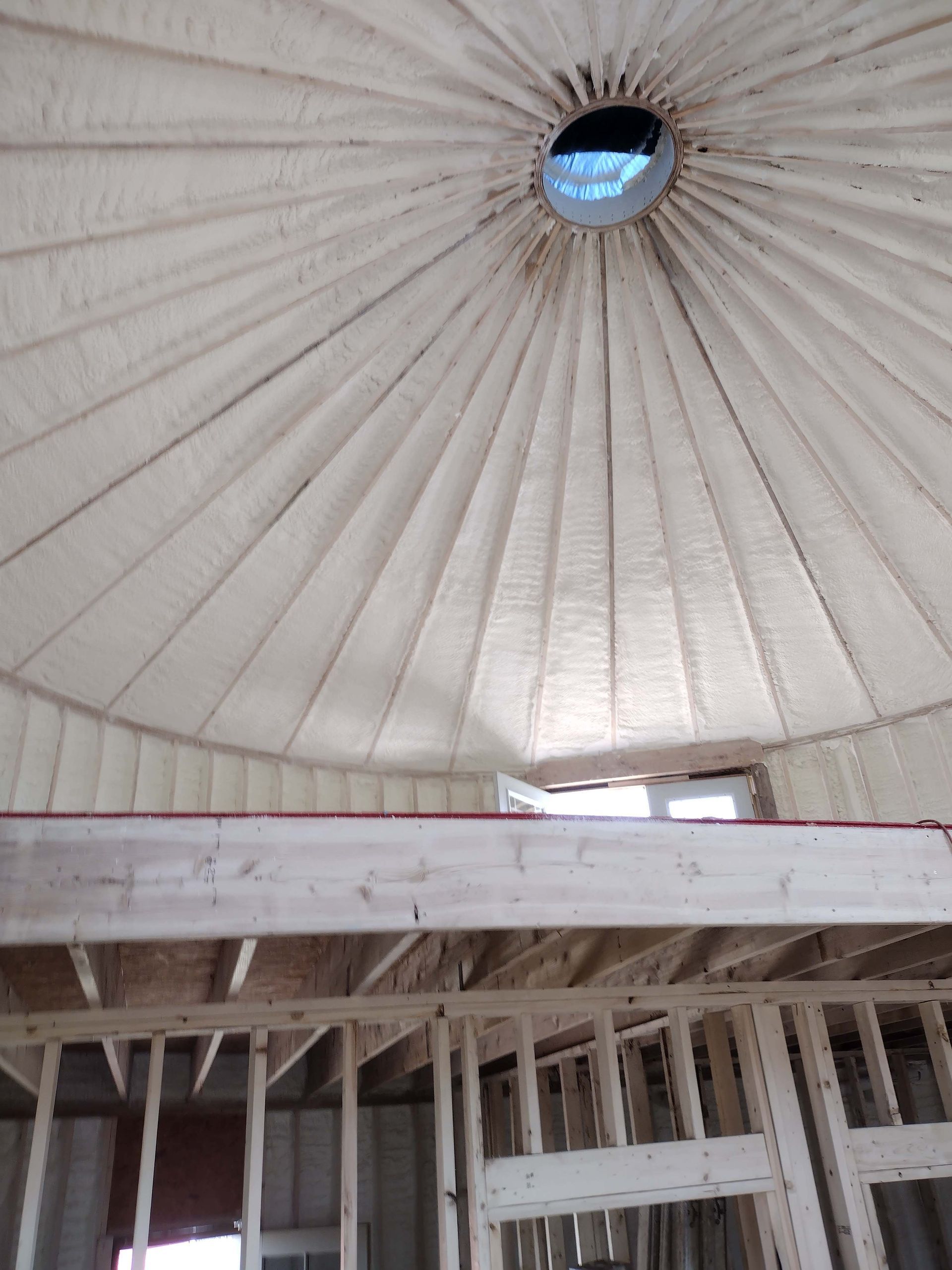 A dome shaped ceiling with a window in the middle of it.