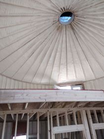 A dome shaped ceiling with a window in the middle of it.