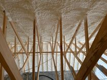 The ceiling of a building under construction is covered in foam.
