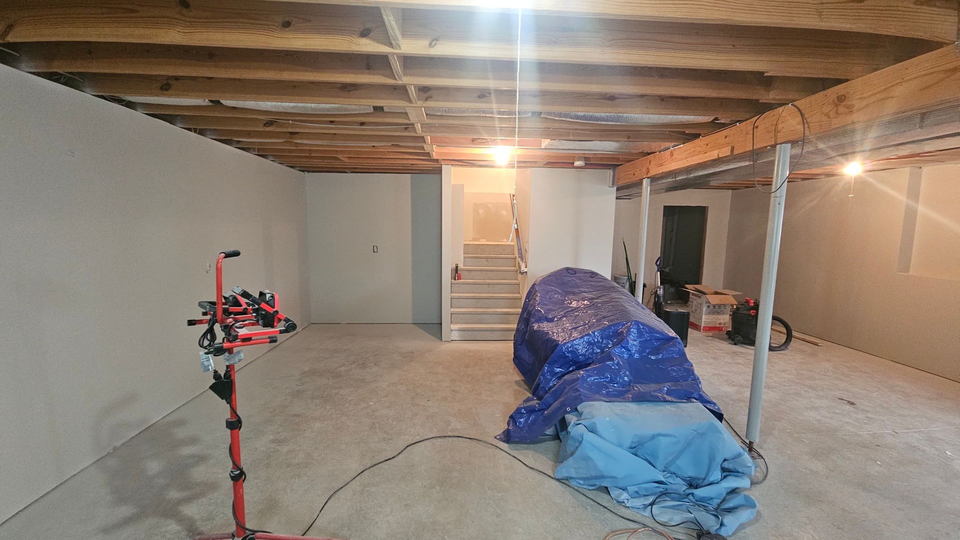 A professional handyman repairing a damaged ceiling.