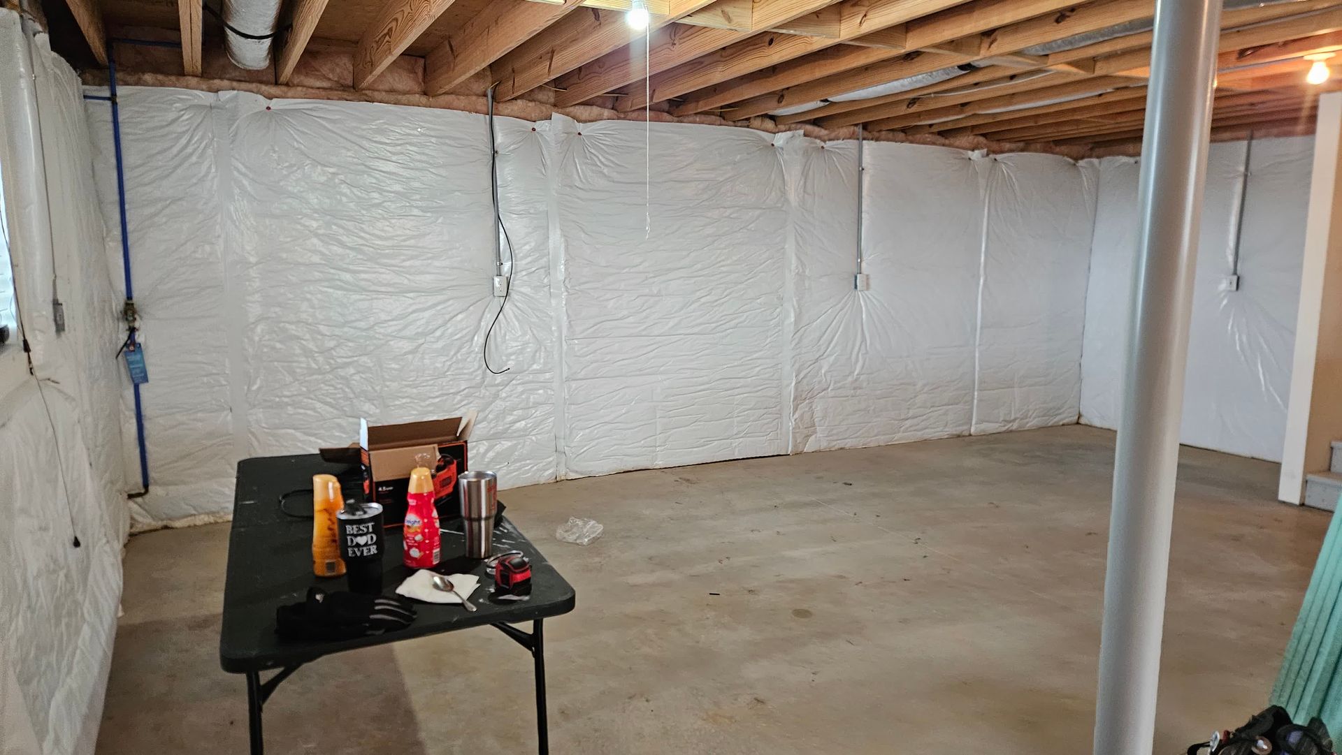 An image showing a professional worker repairing a damaged ceiling.