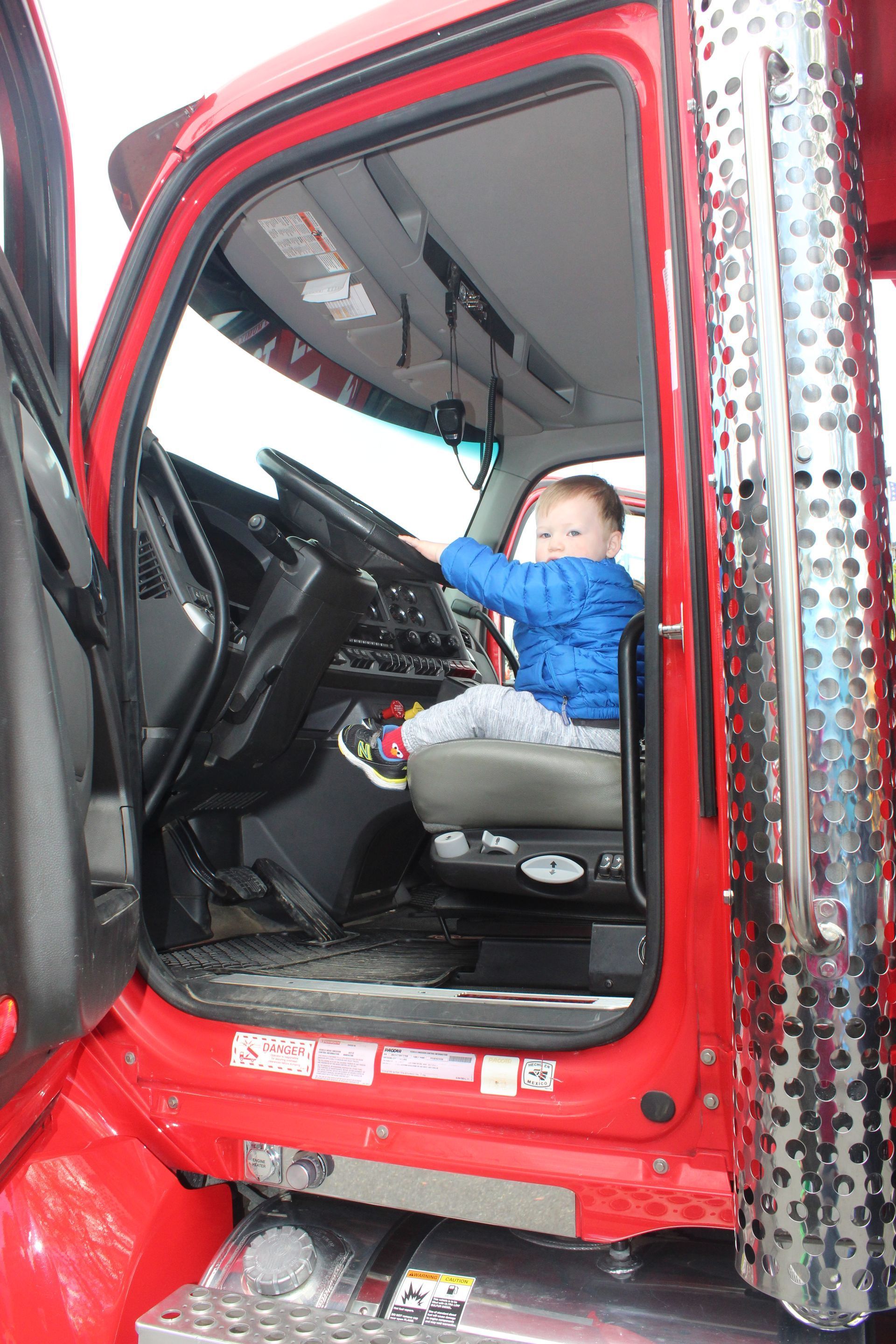 A little one checking out dump truck at the event. 