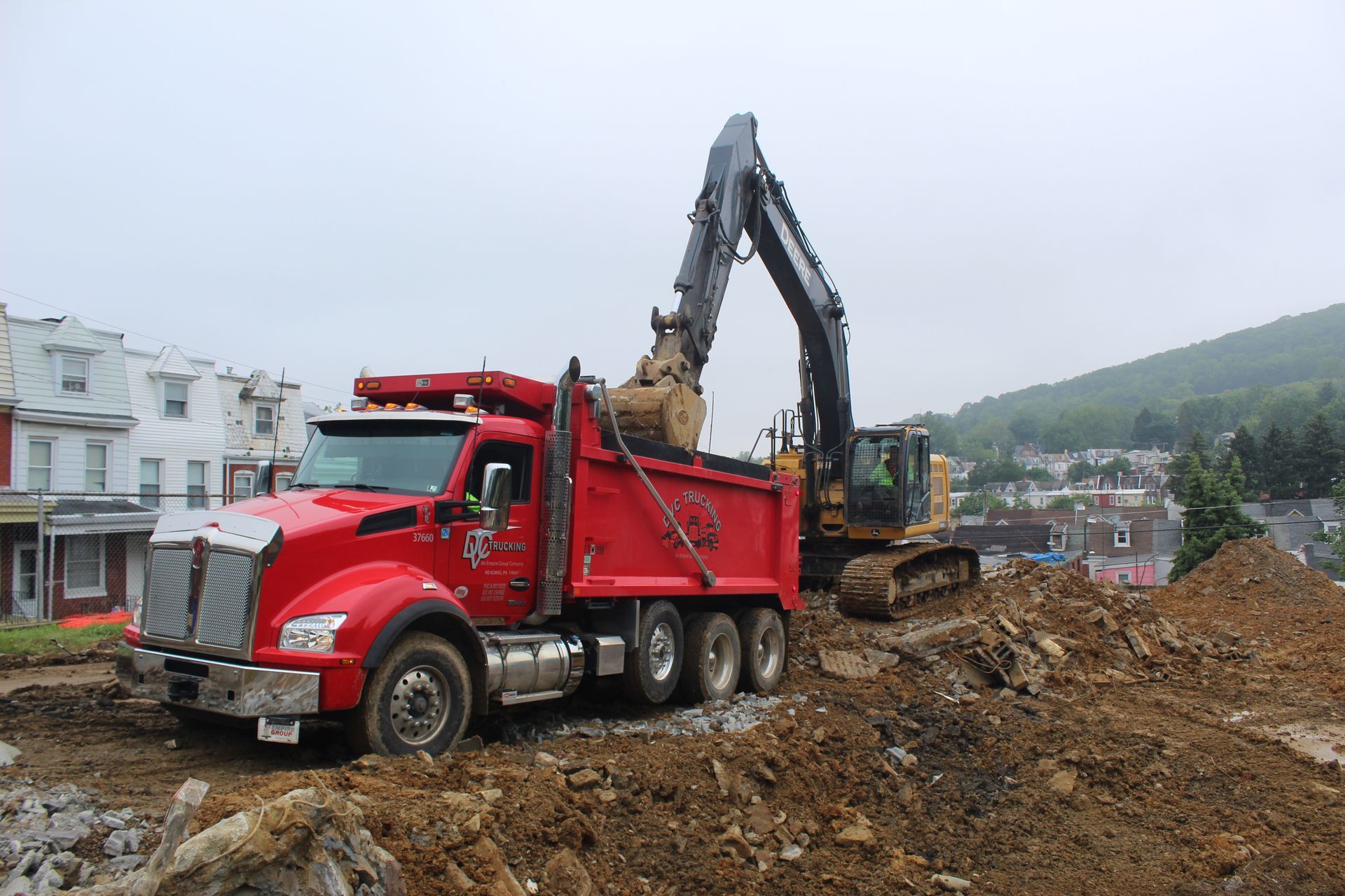Transporting concrete and soil from an old community pool.