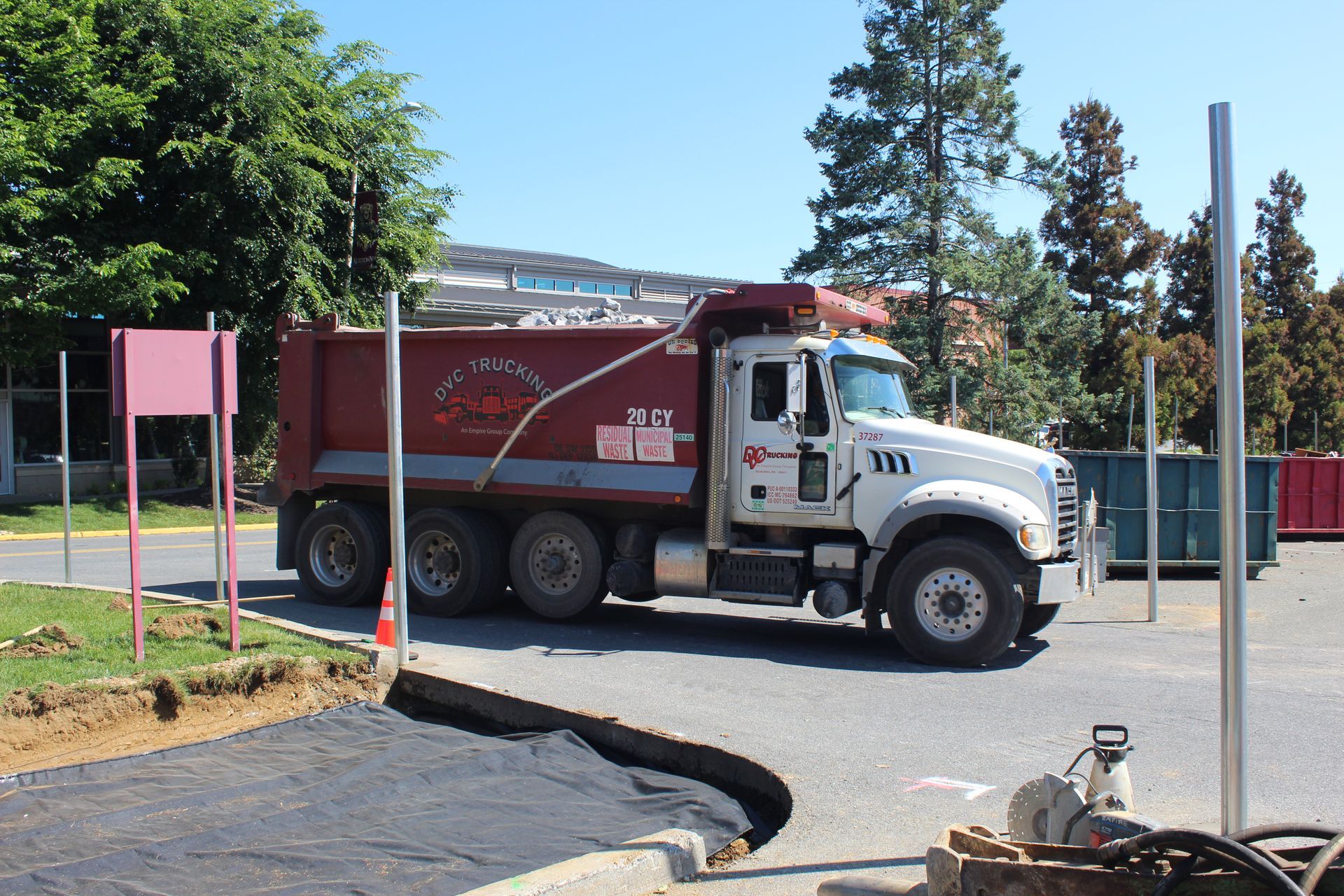 Delaware Valley Contractors delivers stone around new construction fencing for a new construction entrance at local university.