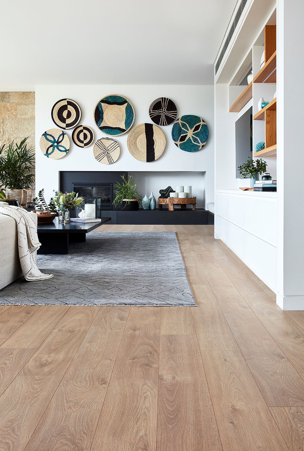 A Living Room with A Wooden Floor and A Fireplace — Geoff Thompson's Independent Flooring Centre In Port Macquarie, NSW