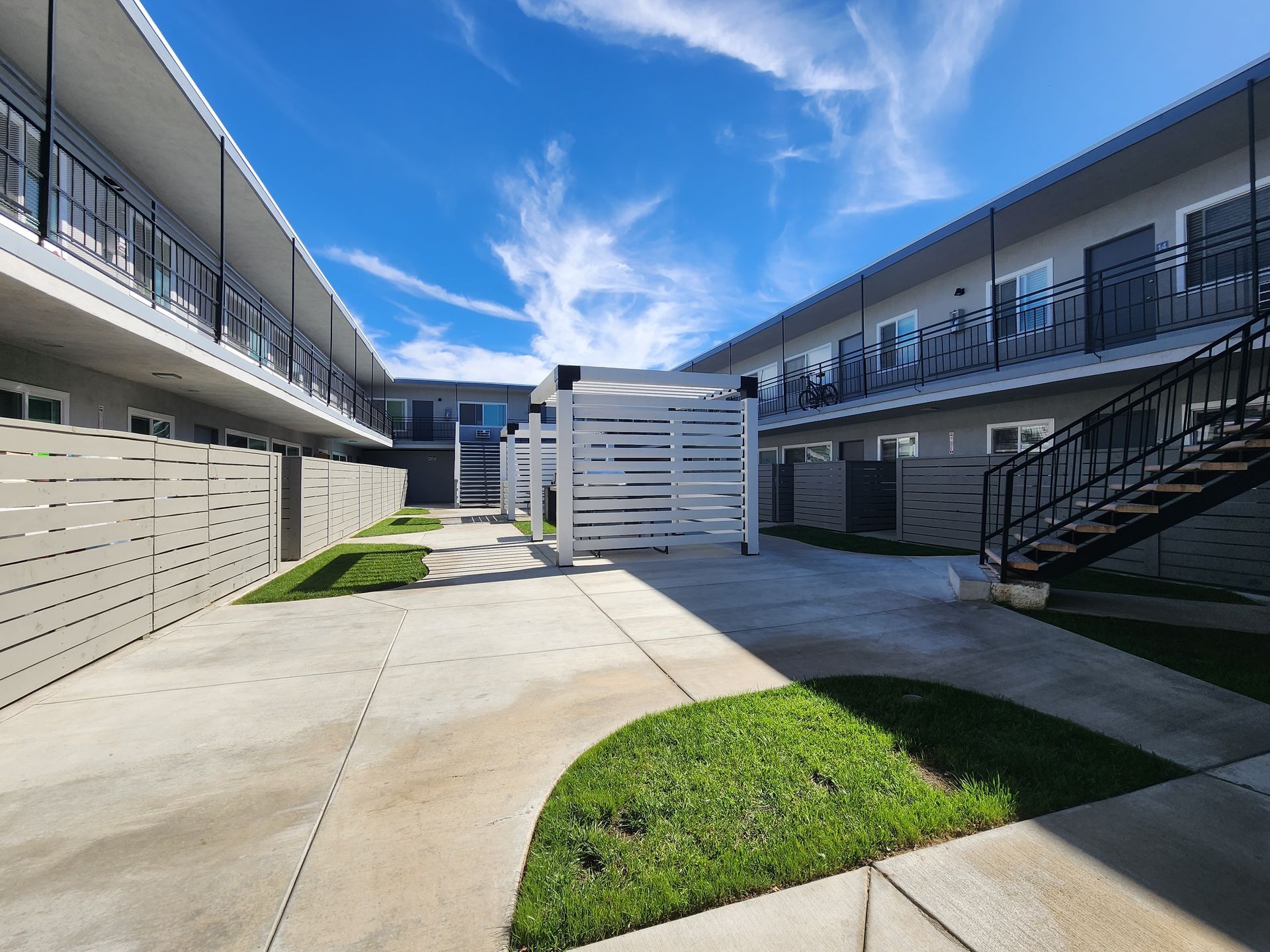 Photo showing an apartment complex courtyard from the ground level