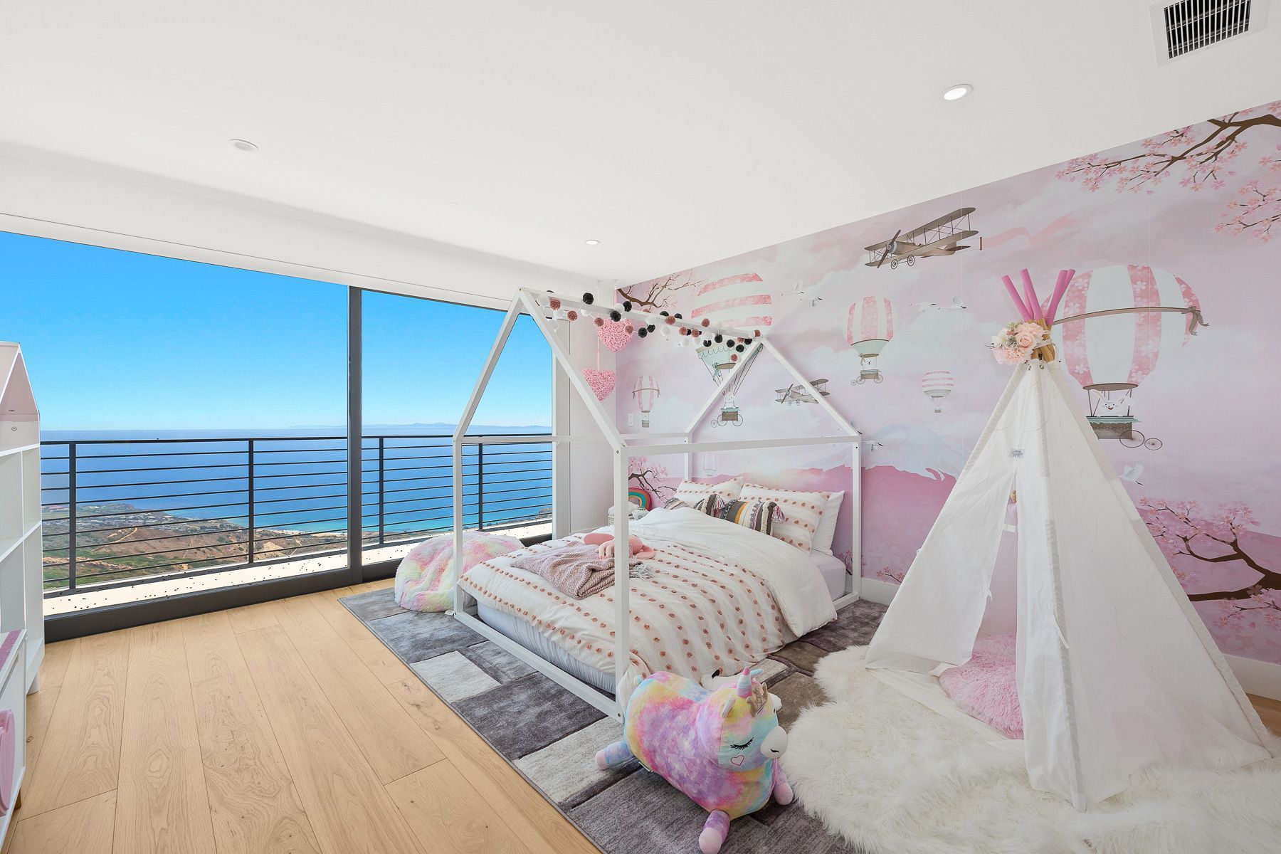 Photo showing a bedroom with plenty of natural lighting