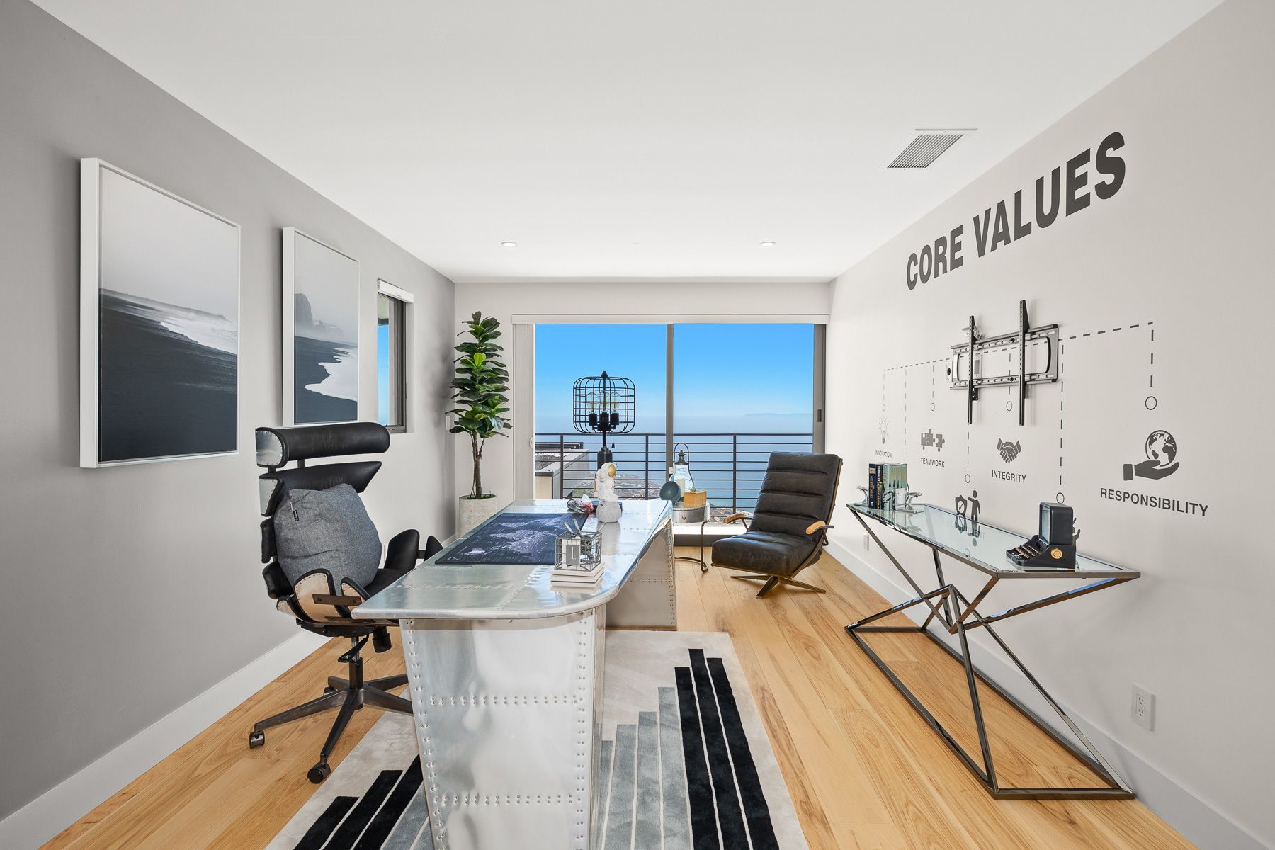 Photo showing a small office with plenty of natural lighting and contemporary amenities