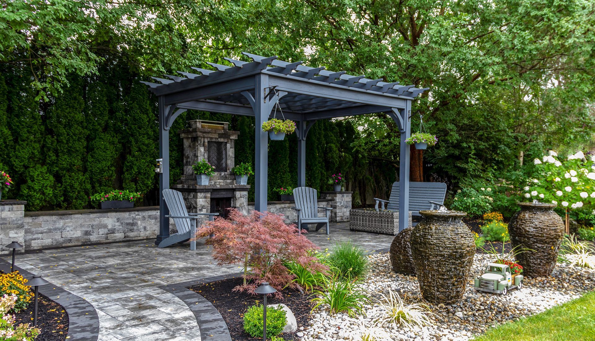 There is a pergola in the middle of the garden.