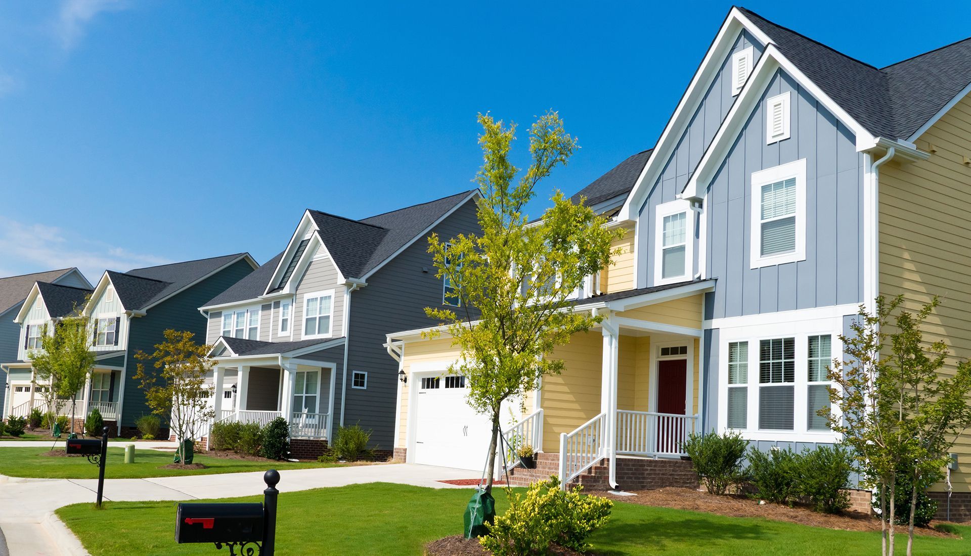 A row of houses with a mailbox in front of them