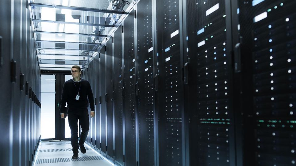 man walking through virtual server room