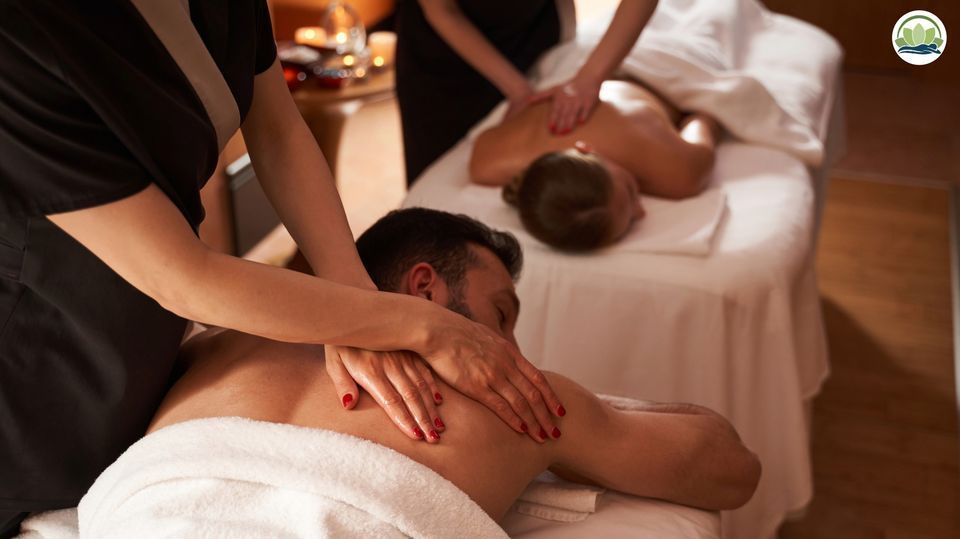 Two men are getting a massage at a spa.