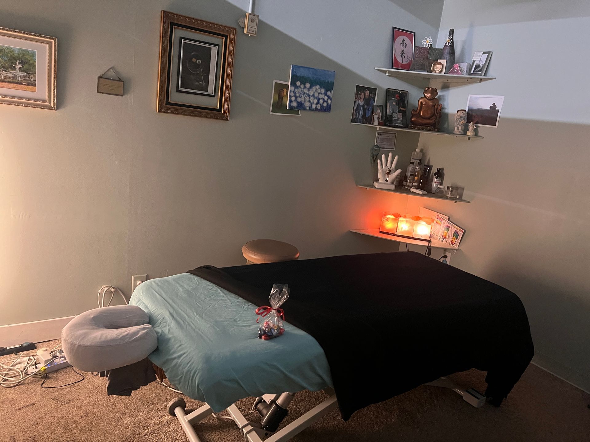 There is a massage table in the middle of the room.
