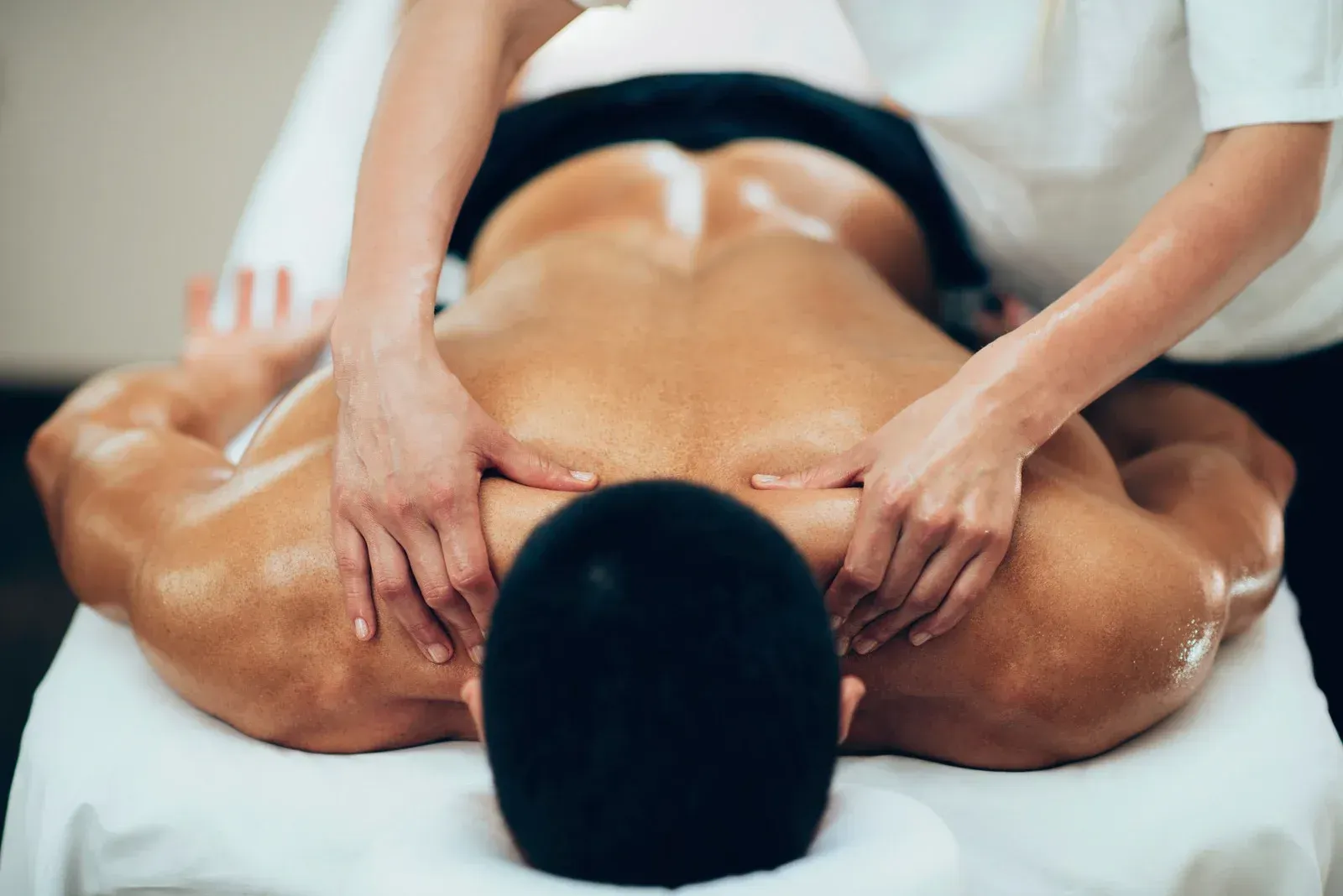 A man is getting a massage at a spa.