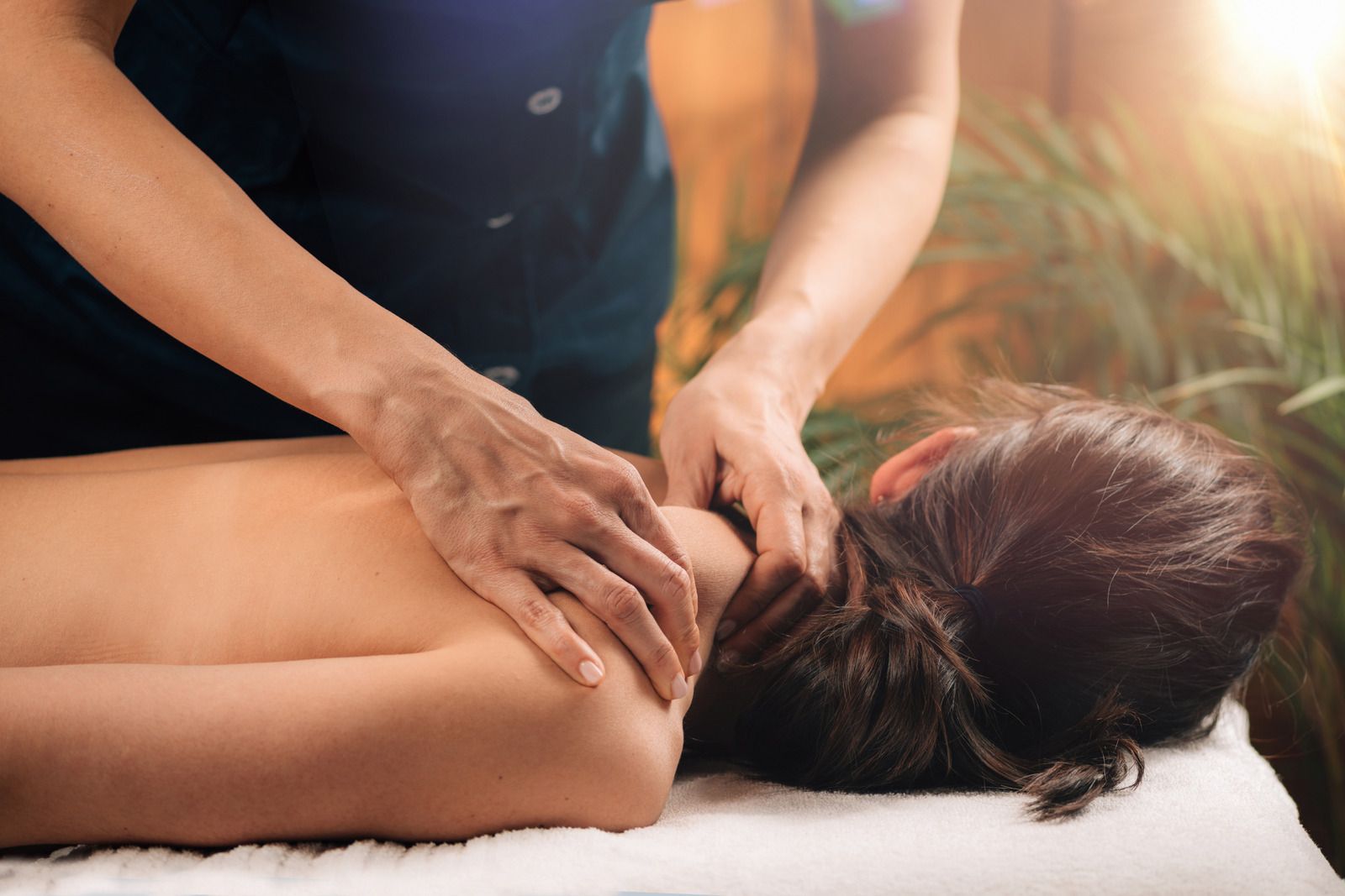 A woman is getting a massage at a spa.