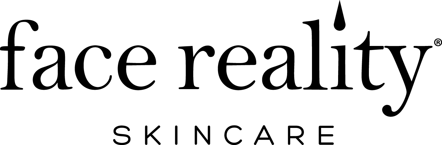 A group of Face Reality cosmetics sitting on top of a white podium.