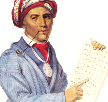 A man holding a piece of paper with letters on it