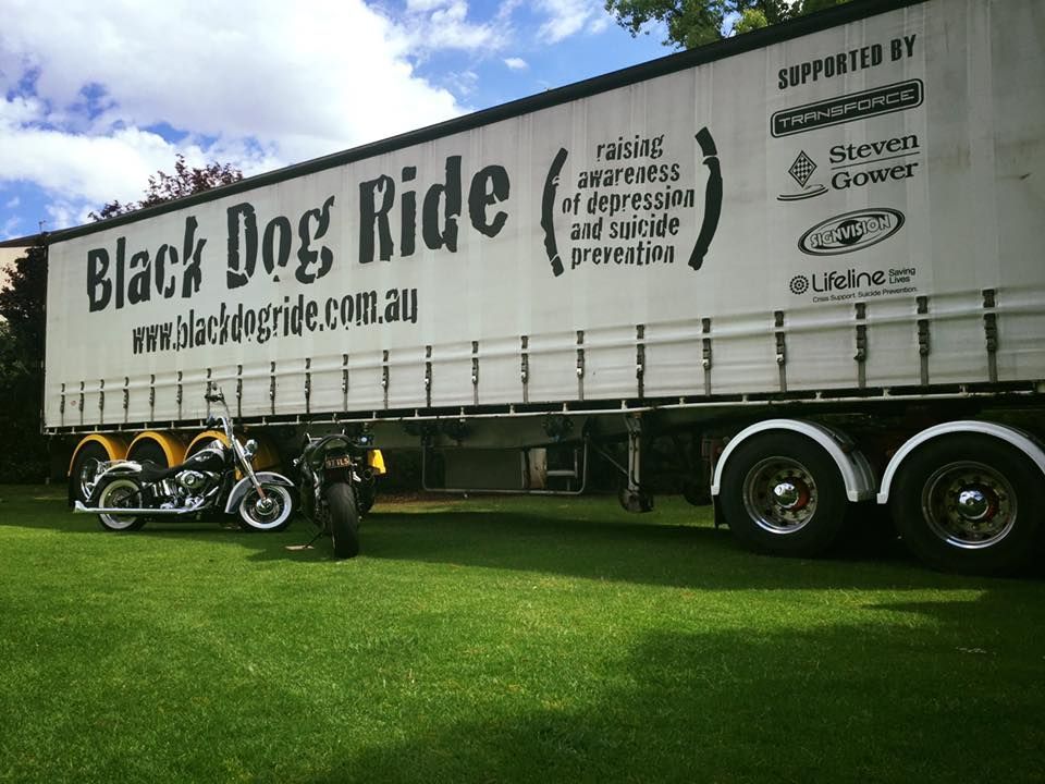 Motorcycle is Parked in Front of a Trailer That Says Black Dog Ride — Transforce in Wellington, NSW