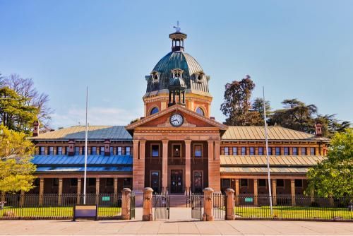 Large Building With a Dome and a Clock on Top of It — Transforce in Bathurst, NSW