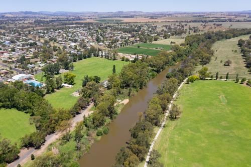 An Aerial View of a River Surrounded by Trees and Grass — Transforce in Cobar, NSW
