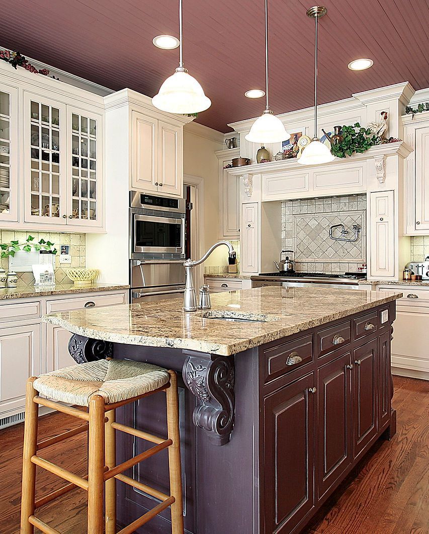 A kitchen with a large island and stools