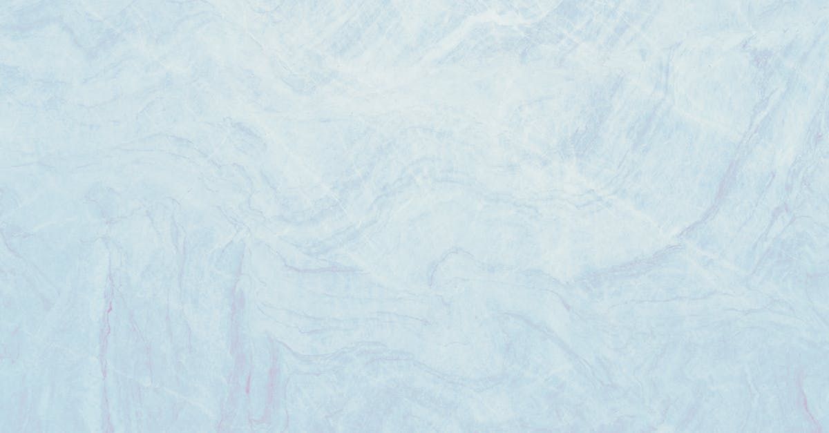 A close up of a herringbone pattern on a tile floor.