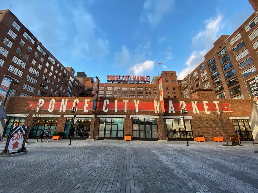 A large brick building with a sign that says ponce city market at Marq on Ponce.