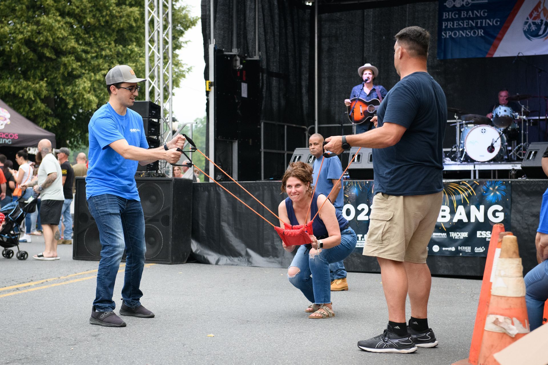 A group of people are playing a game on a stage.